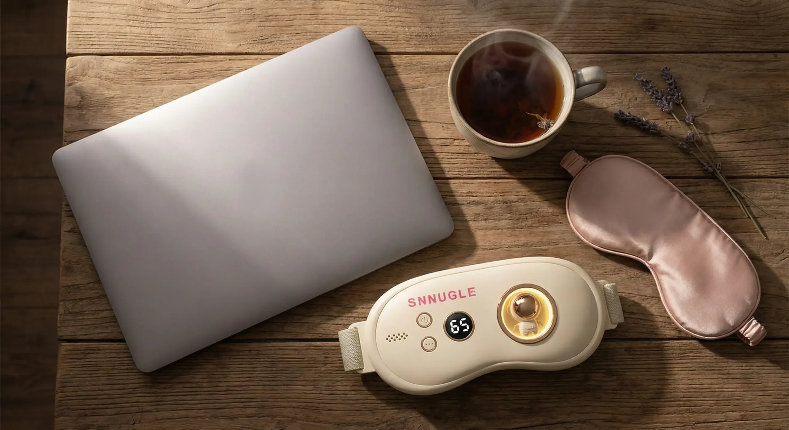 Aesthetic flat-lay showing stress-relief tools like herbal tea and a Snnugle warmer to combat cortisol-induced pain.